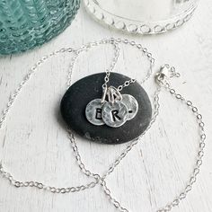 Sterling silver keepsake Initial necklace. Small circle charms are textured and stamped with the letters that mean the most to your heart. Add your initials in the order notes box at checkout. Solid sterling silver charms 1/4 wideSterling silver cable chain. Personalized Small Charm Necklaces For Everyday, Small Personalized Charm Necklaces For Everyday, Sterling Silver Name Necklace With Charms For Mom, Sterling Silver Initial Necklace With Charms, Sterling Silver Round Pendant Initial Necklace With Charms, Adjustable Nickel-free Silver Name Necklace, Adjustable Silver Nickel-free Name Necklace, Everyday Sterling Silver Stamped Necklace, Personalized Sterling Silver Initial Necklace With Charms