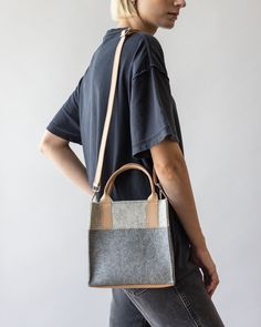 Small but mighty, the Jaunt Mini Merino Wool Tote is designed for both style and versatility. This compact tote holds essentials while adding character to any outfit and can be carried as a chic handheld or worn as a crossbody for hands-free ease. Perfect for quick errands or casual outings, it’s a refined yet functional piece for your everyday wardrobe.

  

 Benefits of Merino Wool 

  
 * Sustainable, biodegradable, and renewable 
 * Odor, stain, heat, and dirt-resistant 
 * Oeko-Tex® Certifi Modern Everyday Crossbody Satchel, Modern Crossbody Satchel For Daily Use, Modern Crossbody Satchel For On-the-go, Modern On-the-go Crossbody Satchel, Modern Rectangular Bag Strap For Everyday Use, Modern Satchel Bag Strap, Modern Bag Strap With Removable Pouch For Daily Use, Leather Bag Strap With Leather Trim For Everyday Use, Leather Trim Crossbody Shoulder Bag For Work