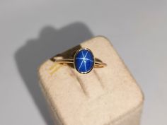 Band: Aarohi Jewellers Material : 14k Yellow Gold Gemstone :Lab Blue Star Sapphire  Blue Sapphire  Stone Weight : 2.20 Ct Blue Sapphire Stone Size : 8x6 mm Gross Weight : 1.400 Gm Style: Minimalist All of our Jewelry is handmade with great care by our team.  Thank you for visiting our store.  https://www.etsy.com/your/shops/Aarohijewellers/tools/listings/create Gold Sapphire Ring Star, Sapphire Gold Ring, Gold Ring Stacking, Star Sapphire Ring, Blue Star Sapphire, Ring Gifts, Star Sapphire, Ring Stacking, Pretty Jewelry