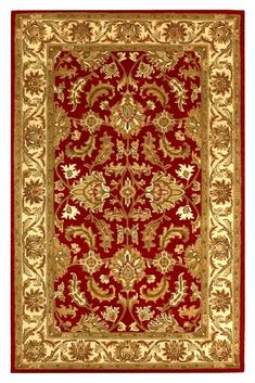 a red rug with gold accents