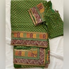 This Is A Brand New Green And Gold, Orange, Yellow And Red Border With A Blouse 38-40 Size Traditional Green Blouse With Dupatta, Semi-stitched Green Bohemian Blouse, Green Bohemian Sets For Puja, Bohemian Green Puja Sets, Bohemian Green Sets For Puja, Green Traditional Blouse With Bandhani Print, Traditional Green Blouse With Bandhani Print, Bohemian Green Blouse With Zari Work, Festival Bandhani Print Green Blouse Piece