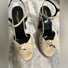 Nwt Yves Saint Laurent Wood Wedge Sandals. Cream Color Knotted Detail, Leather, Wood Heels, Size 10, Never Worn, Comes In Original Box. Clean/Smoke-Free Owner. $650 Or Best Reasonable Offer Luxury Open Toe Wedge Sandals With Sculpted Heel, Luxury Wedge Sandals With Wrapped Heel And Ankle Strap, Luxury Wedge Sandals With Sculpted Heel, Party Beige Wedge Sandals With Wrapped Heel, Beige High Heel Wedge Sandals Elegant Style, Designer Wedge Sandals With Sculpted Heel, Luxury Wedge Sandals With Wrapped Heel, Luxury Wrapped Heel Wedge Sandals, Luxury High Heel Wedge Sandals With Wrapped Heel