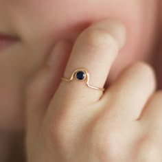 "This unique gemstone ring is the perfect addition to any stack! It is also available in every birthstone which makes it an ideal gift for any jewelry lover! The gemstones in the pictures feature a pink ruby (July birthstone) and blue sapphire (Sept birthstone). This ring is made with a 4mm gemstone and the metal options are: 14k gold filled, 14k rose gold filled, sterling silver, solid 14k yellow gold or solid 14k rose gold. You can select your preference via the drop down menu before adding it Donut Jewelry, Pascal Campion, Birthstone Stacking Rings, Mothers Ring, Dot Ring, Pink Ruby, Mother Rings, Birthday Ring, Minimal Jewelry