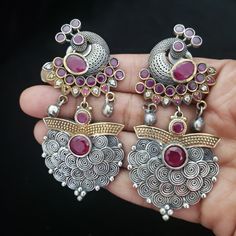 These Jhumka Earrings set have an excellent finish and gives out an exquisite sense of style. If you are looking for an amazing Fashion Jewelry set for special occasions such as Anniversary, Engagement, Party, Wedding or for gifting , then your search ends here. Handmade Indian Temple Jewelry, best to wear it for traditional ceremonies or Indian wedding. This bridal jewelry has ethnic finish. It has Cubic Zircon stones with ruby and emeralds. It is a Bollywood style one gram jewelry. There are l Traditional Dual-tone Earrings For Gift, Traditional Dual-tone Earrings As Gift, Elegant Oxidized Chandbalis For Festivals, Dual-tone Metal Earrings For Wedding, Wedding Dual-tone Metal Earrings, Elegant Oxidized Finish Chandbalis As A Gift, Elegant Oxidized Chandbalis As Gift, Elegant Chandbalis With Oxidized Finish As Gift, Elegant Gift Chandbalis With Oxidized Finish