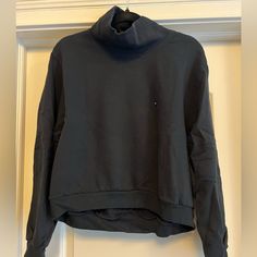 Mock Neck. Cropped Fit In Front. Never Been Worn. New With Tags. Soft A&F Collection Casual Black Turtleneck For Layering, Athleisure High Neck Tops With Ribbed Cuffs, Solid Funnel Neck Top With Ribbed Cuffs, Relaxed Fit High Neck Top With Ribbed Cuffs, Athleisure Turtleneck Top With Ribbed Cuffs, High Neck Top With Ribbed Cuffs In Relaxed Fit, High Neck Top With Ribbed Cuffs And Relaxed Fit, Black High Neck Top For Streetwear, Winter Sports High Neck Tops