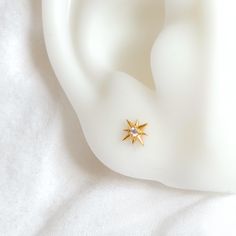 Add a celestial touch to your earring stack with the Astra studs. With their unique tiny design, these sparkly earrings are perfect for upper lobe piercings, and will sure add a touch of playfulness and charm to any look.  DETAILS *Very tiny size. 6mm (See size comparison image) *Choose between Stainless Steel bonded with 18k Gold PVD plating or Silver finish stainless steel. *Nickel, Cadmium and Lead free. *Sold as a pair, you may wear them solo as a piercing or together. ---------------------- Celestial Star-shaped Hypoallergenic Earrings, Celestial Star Hypoallergenic Earrings, Everyday Celestial Star Earrings, Celestial Star Cartilage Earrings As Gift, Celestial Earrings With Star Charm As Gift, Celestial Hypoallergenic Earrings For Everyday, Hypoallergenic Celestial Earrings For Everyday, Tiny Star-shaped Earrings For A Gift, Tiny Star Earrings For Everyday