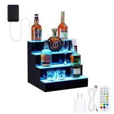 a set of three shelves with liquor bottles and remotes