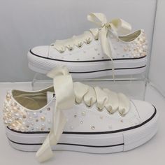 Converse Platforms embellished with : - Fully embellished backstrips with Champagne and Rose Gold Pearls and Gold and Clear Swarovski crystals - Pearls and Swarovski crystals embellished on the outsides of the shoes in a spray gradual fade effect - Finished with Beautiful full Ivory satin laces Embellished Low-top Wedding Sneakers, Embellished Lace-up Sneakers For Weddings, Champagne And Rose Gold, Wedding Sneakers For Bride, Bedazzled Converse, Converse Platforms, Converse Wedding, Converse Wedding Shoes, Bedazzled Shoes