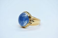 - vintage Art Deco - marked and tested 10k gold - Quartz (PAINTED BLUE) - Quartz measures approx: 16mm x 14mm - size 9 - weighs 10 grams Timeless Blue Signet Ring With Polished Finish, Timeless Blue Gemstone Signet Ring, Formal Blue Hallmarked Signet Ring, Formal Blue Signet Ring, Blue Cabochon Sapphire Ring In 14k Gold, Blue Cabochon Rings Art Deco Style, Blue Cabochon Signet Ring For Anniversary, Blue 14k Gold Signet Ring With Gemstone, Art Deco Blue Cabochon Rings