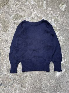 Knit letterman sweater from the 1940's, made by the brand James W. Brine Athletic Supplies, made in the USA. Heavy wool knit material, dark navy colour. Extra long cuffs. No size tag, fits size M best, could fit a bigger size S as well. 8.5/10 condition, minor signs of wear, amazing condition for the age. 19x25.5 Classic Navy Crew Sweater, Classic Navy Knitted Sweater, Vintage Crew Neck Winter Sweater, Vintage Solid Sweater With Ribbed Cuffs, Vintage Navy Sweater With Long Sleeves, Navy Vintage Long Sleeve Sweater, Vintage Crew Sweater With Ribbed Cuffs, Vintage Crew Neck Sweater With Ribbed Cuffs, Letterman Sweaters