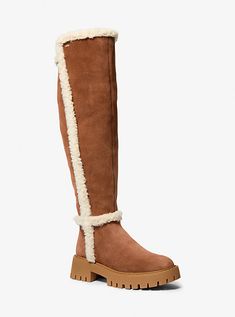 Our Asher boot will add luxe texture to any look. This knee-high style is rendered in supple suede contrasted by faux shearling lining and trim, while a lug sole and water-resistant finish delivers practicality. Suede Tall Boots, Michael Kors Boots, Luggage Sizes, Tall Riding Boots, Shearling Boots, Hype Shoes, Tan Suede, Lug Sole, Tall Boots