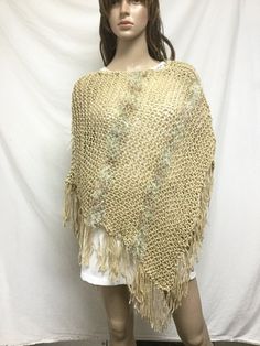 Knit Poncho,tan, w/ Woven in Gold, fringed poncho Casual One Size Poncho With Fringe, Casual One-size Poncho With Fringe, Bohemian Beige Poncho For Fall, Casual Festival Poncho With Fringe, One Size Brown Fringe Poncho, Brown One Size Poncho With Fringe, Brown Fringe One Size Poncho, Casual One Size Fringe Shawl, Casual One-size Shawl With Fringe