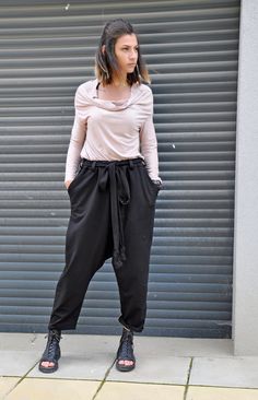 "Women Harem Pants, Black Wide Leg Pants, Drop Crotch Pants Black loose cotton pants, casual extravagant black pants. Woman black pants. Very comfortable loose pants. This pant is very convenient for your daily life. All my clothes are unique and boutique. Model wearring size: S SIZE S (US 6, UK 10, Italian 40, French 38, German 36, Japan 7) bust: fits bust around 35.5\" / 90cm Waist: fits waist around 28\"/ 71cm Hips: fits hips around 38\"/ 97cm For overall height: 5'5\" / 165cm around Shop siz Baggy High-waisted Harem Pants, Versatile Style, Versatile Baggy High-waisted Harem Pants, Baggy Pants Plus Size, Clown Pants, Loose Cotton Pants, Black Harem Pants, Pants Woman, Pants Baggy, Drop Crotch Pants