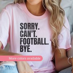 Show off your "Football Mom" pride with this witty and fun "Sorry. Can't. Football . Bye." t-shirt! Perfect for any youth Football enthusiast, this casual graphic tee is ideal for game days or everyday wear. Available in various colors to match your style. ⚾ Playful Design: Featuring a bold and humorous message, this shirt is perfect for baseball fans who prioritize the game. 🌈 Custom Colors: Choose from a range of colors to find the perfect fit for your personal style. 👕 Comfortable Fabric: M Sporty T-shirt With Funny Text For Sports, Football Mom Shirts Ideas Diy, Pink Crew Neck T-shirt For Sports Events, Pink Crew Neck T-shirt For Game Day, Football Season Fan Apparel T-shirt With Letter Print, Football Season Letter Print Fan T-shirt, Funny Text Crew Neck T-shirt For College, Pink Team Spirit Tops For Fan Gear, Football Season Fan Apparel Tops With Letter Print