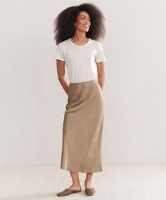 Sawyer Slip Skirt UmberThe Sawyer Slip Skirt is the classic piece that is designed to elevate your seasonal wardrobe. 100% viscose. Made in China of Italian fabric.Slip skirt that hits at ankles. Linen Slip Skirt Outfit, Flowy Slip Skirt, Knit And Slip Skirt, Brown Relaxed Midi Skirt, Jenni Kayne Slip Dress, Seasonal Wardrobe, Cocoon Cardigan, Cardigan Sweater Coat, Jenni Kayne