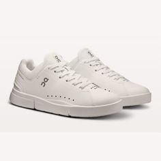 Women's THE ROGER Advantage All White RETAIL PRICE: $140.00 Clean lines, an improved fit and more cushioning make this tennis-inspired sneaker a true wardrobe staple. Easy to style. Easy to love. Cushioned ride Though you can’t see it, you’ll feel the concealed CloudTec® cushioning as soon as you step in. Team this with TPU-injected Speedboard®, and you’ve got the perfect balance of stability, flexibility and energy return. Easy to style This tennis-inspired shoe has a fresh, pared-back design that works well with every outfit. Together, the faux leather upper and technical mesh tongue deliver the ultimate blend of street-style and athleticism. Built for comfort The inner sock construction keeps your feet comfy and secure, while additional cushioning in the forefoot feels soft underfoot. T White Athletic Sneakers, Bday Wishlist, Natural Movement, Walking Sneakers, Sneaker Shoes, Easy To Love, Athletic Sneakers, All White, Mesh Fabric