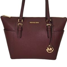 Michael Kors Charlotte Large Top Zip Tote Bag Dark Cherry/Burgundy Purse Saffiano Leather. New Without Tags. Please See Pictures. * Guaranteed Authentic. * Top Zip Closure. * Interior: One Large Main Compartment With Two Open/Slip Pockets, One Zip Pocket. * Exterior: Two Large Open/Slip Pockets (One On Each Side). * Gold Tone Hardware. * Mk Logo Bag Charm. * Fully Lined. * Double Shoulder Straps With A 9.5 Drop. * Measurements: Approximately 15" (Across The Top) X 10" X 4". Check Out Our Huge Se Michael Kors Burgundy Shopping Bags, Michael Kors Burgundy Bags With Branded Hardware, Elegant Michael Kors Burgundy Bag, Michael Kors Luxury Burgundy Bags, Michael Kors Burgundy Bag, Luxury Michael Kors Burgundy Bags, Luxury Burgundy Michael Kors Bag, Classic Burgundy Bag With Zipper Closure, Burgundy Purse