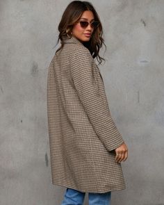 The ultimate outerwear piece for making a bold, fashion-forward statement is the Keep It Chic Houndstooth Print Trench Coat. Crafted from heavyweight brushed wool fabric, this coat keeps you warm while looking polished and put-together. The classic houndstooth print brings timeless sophistication, while the double-breasted front button closure and padded shoulders add a structured, tailored edge. Heavyweight brushed wool fabric Double breasted front button closure Padded shoulders Side slant pockets Lined Self: 50% Wool 50% Polyester Lining: 97% Polyester 3% Spandex Double-breasted Wool Houndstooth Outerwear, Wool Double-breasted Houndstooth Outerwear, Chic Plaid Wool Outerwear, Plaid Wool Coat For Fall Workwear, Chic Plaid Long Coat, Wool Houndstooth Outerwear For Winter, Plaid Double-breasted Houndstooth Outerwear, Winter Wool Houndstooth Outerwear, Chic Houndstooth Winter Outerwear