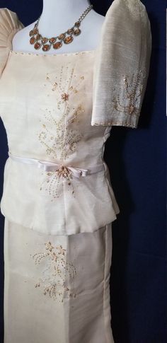 "Ladies, here's your chance to get your very own traditional Filipiniana outfit. This listing is for a HAND-BEADED 2-piece Barong Gown (also called Terno) created by artisans from the Philippines. Wear it to that next wedding, debut, graduation or Simbang Gabi. Look at the pictures to see the fine details that went into making this gown. Here are the specs of the outfit that you're getting: *Color: Beige *Fabric: The fabric closely resembles pinya cloth (look at the lined fibers in the pictures) Lady Barong Outfit, Formal Floor-length Sets With Pearl Embroidery, Formal Sets With Pearl Embroidery And Traditional Drape, Fitted Sets With Intricate Embroidery For Evening, Fitted Evening Sets With Intricate Embroidery, Elegant Gold Embroidered Floor-length Sets, Elegant Floor-length Sets With Gold Embroidery, Traditional Evening Sets With Gold Embroidery, Pearl Embroidered Organza Sets For Evening