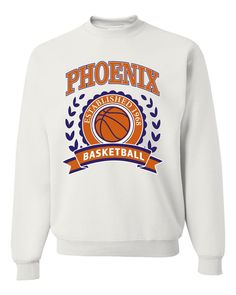 Phoenix Arizona PHX Hometown City Team Pride | Fantasy Basketball Fan Sports Merch Apparel, State Basketball, Sports Men's T-Shirt Pick a sport, any sport we've got you covered. From Football and Baseball to Table tennis and Horseback Riding whatever your passion we have a cool design for you to wear while to showing off your skills 👕 TOP QUALITY: Our shirts are made with a soft, pre-shrunk 50/50 cotton/polyester blend, ensuring maximum comfort and durability. We also use the newest, high-tech printing techniques available, guaranteeing the finest print on the market.⛹️⛹️⛹️ 👕 EASY CARE: Care for your t-shirts with ease, simply machine wash inside-out, cold with like colors. No complicated care instructions needed! ⛹️⛹️⛹️ 👕 SIZES AVAILABLE: Our t-shirts are designed to fit just about eve Crew Neck T-shirt For Sports Season, Collegiate Moisture-wicking Sweatshirt For Sports, Team Spirit Moisture-wicking Sweatshirt For Sports Events, Sporty Crewneck T-shirt For Sports, Sporty Crew Neck T-shirt For Sports, Sports Merch, Fantasy Basketball, White Crewneck, Basketball Fans