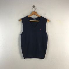 PLEASE READ DESCRIPTION BELOW BEFORE BUYING👇🏻 *ITEM:Polo Ralph Lauren Vest *ITEM DETAILS: 👇🏻 Please be aware that all vintage items will usually show a few signs of wear or fading due to age, but anything visible such as stains or holes, and serious flaws have been photographed.For any further information on this item please contact us and we will be happy to help. *SIZE:SMALL *ACTUAL SIZE MEASUREMENT: 👇🏻 *PIT TO PIT(WIDTH):17"INCHES *LENGTH(FROM SHOULDER): 23"INCHES  *ALL MEASUREMENTS ARE TAKEN WITH THE GARMENT FLAT ON THE GROUND *VIEW FULL SHOP HERE: https://www.etsy.com/shop/Tracstore *SHIPPING: (WITH ONLINE TRACKING NUMBER ) *DHL EXPRESS SHIPPING:4-6 BUSINESS DAYS *Don't Worry About Customs Tax or Fees. I usually Declare As 'Gifts' And Low Value  *ANY QUESTION WILL ANSWER WITHIN Blue Knit V-neck Vest, Casual Sleeveless Sweater For Winter, Casual Sleeveless Winter Sweater, Cotton Sleeveless Sweater Vest For Fall, Blue Sleeveless Sweater Vest For Winter, Casual Blue Knit Vest, Winter Cotton Sleeveless Vest, Blue V-neck Knit Vest, Blue V-neck Tank Top For Fall