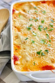 a casserole dish with cheese and herbs