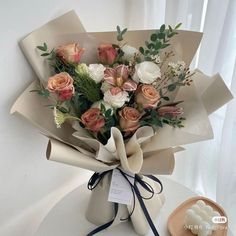 a bouquet of flowers sitting on top of a table