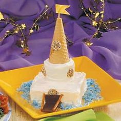 a white cake with a gold star on top