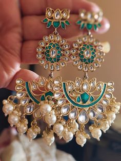 Polki Earrings Sabyasachi Inspired Jewelry Kundan Earrings Uncut Polki Jewelry Chandbali Earrings Moissanite Polki Emerald Green Earrings Add a touch of elegance to your ensemble with our stunning golden earrings adorned with green pearls and white Kundan, accented with intricate mirror work. These handcrafted earrings exude traditional charm and sophistication, perfect for elevating your ethnic look. Whether you're attending a wedding, festival, or special occasion, these earrings will make a statement and capture attention with their unique design. Made with high-quality materials, our Kundan earrings are designed to be both stylish and durable, ensuring they become cherished pieces in your jewelry collection. Embrace the beauty of Indian craftsmanship with these exquisite ethnic earring Luxury Round Kundan Jhumkas, Luxury Bollywood Latkans Earrings, Luxury Traditional Kundan Jhumkas, Cheap Chandbali Bridal Earrings For Party, Luxury Kundan Bridal Earrings For Celebration, Luxury Latkans Earrings For Navratri, Luxury Kundan Jhumkas With Zari Work, Luxury Fusion Bridal Earrings For Diwali, Luxury Gemstone Chandbali Earrings