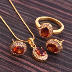 This Sterling Silver Jewelry set features an Elegant Art With Natural Hessonite Gemstone. The cavity is made from genuine solid 925/92.5 Sterling silver with 18k Gold Plating and stamped as S925. This Jewelry is Lead free and Rhodium plated to prevent scratches and tarnish. ITEM DESCRIPTION Item Code: JACBS2/45 Metal: 18k Gold over 925/92.5 Sterling Silver Gemstone: Genuine Natural Hessonite Gemstone Shape: Oval Gemstone Size: 6 X 8 MM Ring Dimension:- Length: 12 MM Width: 11 MM Weight: 3.93 gm Smokey Topaz Ring, Smoky Quartz Ring, Bridal Jewelry Set, Hessonite Garnet, Silver Jewellery Sets, Garnet Jewelry, Earrings Pendant, Jewelry Bridal, Garnet Ring