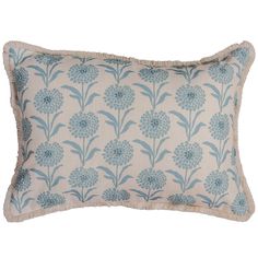 a blue and white pillow with flowers on it