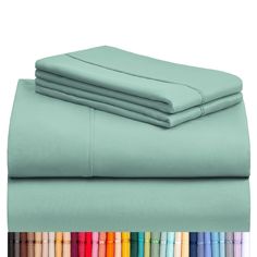 the sheets and pillow cases are all lined up in different colors, with one folded on top