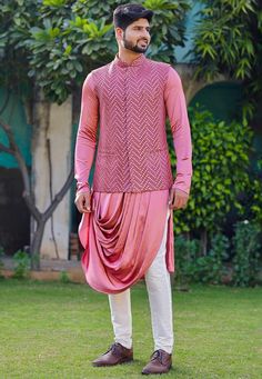 Satin Cowl Style Kurta in Pink. This Readymade attire with Satin Lining is Enhanced with Pockets, Mirror Effect and Resham Work. Crafted in Chinese Collar Neck and Full Sleeve. Available with a Cotton Aligarhi Pant in White and a Faux Georgette Nehru Jacket in PinkDo note: Footwear shown in the image is for presentation purposes only. Half to one inch may vary in measurement. (Slight variation in actual color vs. image is possible) We sell all kinds of menswear. Mens Kurta | Mens Kurta Pajama | Mirror Work Nehru Jacket For Men, Festive Pink Long Sleeve Outerwear, Traditional Pink Nehru Jacket With Long Sleeves, Pink Long Sleeve Sets For Transitional Season, Transitional Long Sleeve Outerwear With Zari Work, Long Sleeve Outerwear With Pallu For Weddings, Pink Embroidered Nehru Jacket With Long Sleeves, Pink Embroidered Long Sleeve Nehru Jacket, Pink Nehru Jacket For Festivals With Long Sleeves