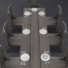 an overhead view of a dining table and chairs