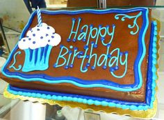 a chocolate birthday cake with frosting and sprinkles