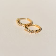 14k Yellow Solid Gold Sold as a pair 11mm Huggies with snap closure 7 diamonds .11CT per hoop. SI-quality All 14k pieces are made to order. Our 14k solid gold will not oxidize or discolor, so you can wear your jewelry every day, everywhere, for years to come. Our diamonds are ethically sourced/conflict-free. Diamond Huggies, Sell Gold, Jewelry Diamond, Local Artisans, Ring Bracelet, Gift Item, Snap Closure, Jewelry Crafts, Diamond Jewelry