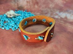 Trinity Wide Leather Cuff Bracelet, Turquoise Wrist Band, Men's Women's, South Western Native American Style Bracelet width 27 mm / 1 inch All my leather art pieces are made by hand. If you want to change the design, I will gladly do it for you. Garden Belt, Florist Tools, Leather Cuff Bracelet, Native American Style, Tool Belt, Leather Art, Wrist Band, Black Mask, Native American Fashion