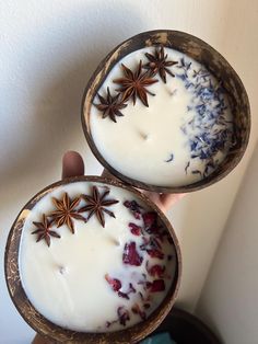 two bowls filled with yogurt and star anise sitting on top of each other