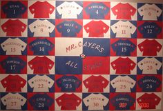 a large poster with the names and numbers of all teams in red, white, and blue