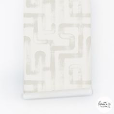 a white and grey wallpaper with an abstract design on the bottom half of it