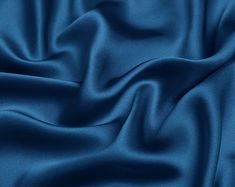 "The item is satin fabric(silk satin, silk stretch satin) of NO.75 silver lake blue color. If you are a professional buyer, please buy our fabric color card directly, so that the color difference between the photo color and the fabric color can be minimized. ●90 Colors Card. https://etsy.me/2OsRK8N ●Silk Fabric Sample. https://etsy.me/2KlMDXG WE COMBINE SHIPPING - Please Contact Us For Custom Order For silk satin we have 16mm, 19mm and 30mm: ●16mm thickness is the preferred fabric for pajamas, s Luxury Blue Art Silk Sets, Silk Fabric Blue, Crepe Fabric Blue, Blue Fabric Swatches, Satin Colors Fabric, Silk Colors Fabrics, Silk Fabric Texture, Satin Fabric Texture, Blue Silk Fabric