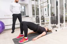 a man and woman doing exercises in a gym