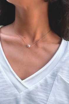 Dainty and minimal, pearl necklace. Designed with the skinniest chain that creates a modern and simple statement. This single necklace is tarnish free and meant to last with the proper love and care. Gold dipped chain and shiny, rounded, pearl. Minimalist White Chain Necklace For Everyday, Chic Chain Necklace With Pearl Pendant, Everyday Chic Pearl Pendant Chain Necklace, Chic Everyday Pearl Pendant Chain Necklace, Trendy Everyday Pearl Necklaces, Trendy Pearl Necklace With Charm For Everyday, Trendy Everyday Pearl Necklace With Pearl Charm, Trendy Everyday Necklace With Pearl Pendant, Trendy Pearl Necklace With Delicate Chain