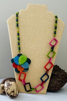 Handmade in Ecuador Necklace Length: 15 Inches Material: Tagua Nut Gold Handmade Clasp Due to this item being handmade and the nature of the Tagua Nut the size and the color may vary from piece to piece Handmade Multicolor Beaded Necklaces, Nature-inspired, Handmade Multicolor Nature-inspired Beaded Necklaces, Nature-inspired Multicolor Beaded Necklaces As Gift, Nature-inspired Green Jewelry With Wooden Beads, Unique Multicolor Flower Necklaces, Unique Multicolor Flower Necklace, African Necklace, Tagua Nuts, Jade Jewelry