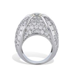 This 18kt White gold French Hallmark Dome Ring is truly breathtaking with its Old European Cut Diamond, plus an awe-inspiring 122pcs of Pave Diamonds and an impressive 24pcs of Baguette Diamonds - all together, this stunning Ring amounts to an eye-catching 6.87ct TW! An Estate Ring of a perfect Size 6. White gold French Hallmark Dome Ring 18kt. White gold Approx. 6.87ct TW Diamonds 1pc Old European Cut Diamond - 1.49ct K-L VS2 ( 7.45x7.43x4.43mm) 122pcs Approx. 4.95ct RBC F/G VS 24pcs Approx 1.9 Estate Ring, Estate Rings, Dome Ring, Baguette Diamonds, European Cut Diamonds, Domed Ring, Store Hours, Baguette Diamond, Diamond Sizes