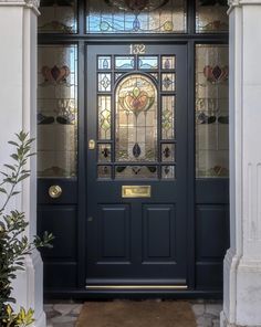 a blue front door with stained glass windows