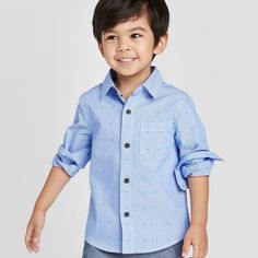 Toddler Boys' Long Sleeve Dressy Clipspot Button-Down Shirt - Cat & Jack This Collared Shirt Comes In Blue Stripes And Features An Intricate Allover Clip Spot Pattern In Hues Of Pink And Green, Easily Bringing A Pop Of Color To Just About Any Outfit. The Button-Down Front And Collared Neckline Lend A Refined Look For Versatile Wear, And The Soft, Breathable Cotton Fabric Helps Him Stay Cool And Comfy Throughout His Day. Cute Blue Button-up Shirt, Cute Blue Collared Shirt, Blue School Shirt With Button Closure, Cute Blue Button-up Top, Playful Spring Shirt For School, Casual Playtime Shirt With Buttons, Cute Button-up Shirt With Details, Casual Buttoned Shirt For Playtime, Cute Blue Shirt With Button Closure