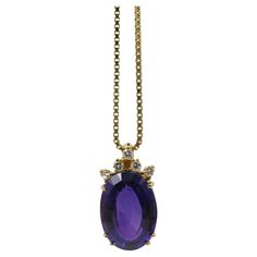 Immerse yourself in the enchanting beauty of this 14k yellow gold necklace featuring a magnificent pendant. The opulent centerpiece of this necklace is a stunning large amethyst, skillfully cut in an oval shape with a step-cut that bears a striking resemblance to an emerald cut but with the unique grace of an oval form. Elevating the allure of the pendant are 5 delicate diamonds, each meticulously cut in a brilliant fashion. These diamonds add a radiant touch of refinement to the pendant, accentuating its beauty with a subtle sparkle. The pendant exudes opulence and sophistication, making it a statement piece that harmonizes with the necklace. The overall design is a perfect blend of charm and prosperity. To truly appreciate the condition and color nuances of this exceptional necklace, I e 14k Yellow Gold Necklace, Yellow Gold Necklace, Step Cut, Art Deco Necklace, Oval Pendant, Natural Tones, Emerald Cut, Oval Shape, Jewelry Necklace Pendant