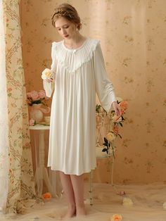 Design Highlights The long-sleeved nightgown designed in a retro style with pleated edges, embroidered lace edges and bow embellishments makes the nightgown overall look very romantic, elegant and feminine. The fabric is made of a mixture of high-purity cotton and spandex, which is comfortable and skin-friendly while being elastic and breathable. Type: Nightdress Color: White Season: All Season Style: Vintage/Romantic Detail: Lace, Ruffled Edge, Embroidered Material: Cotton Composition: 94% Cott Long Sleeve Ruffled Nightgown, Long Sleeve Lace Trim Sleepwear, Long Sleeve Lace Trim Sleepwear For Bedtime, Elegant Nightgown With Lace Trim For Home, Spring Long Sleeve Nightgown With Lace Trim, Spring Long Sleeve Lace Trim Nightgown, Feminine Long Sleeve Nightgown For Home, Long Sleeve Lace Trim Nightgown For Wedding, Long Sleeve Lace Trim Wedding Nightgown