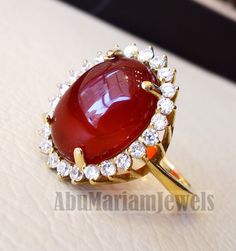 Cluster 18K Gold carnelian red aqeeq agate ladies ring red cabochon oval stone all sizes jewelry classic style white cubic zircon around Risk free Quality guarantee policy : If you are not satisfied with your item for any reason simply send it to us and you will get a replacement or refund . please write or choose your size with the order and we will size it for you . Our ring is handcrafted mostly with a few simple tools . but some methods are used in casting like lost wax method . 18 k gold st Elegant Red Cabochon Gemstones, Exquisite Oval Gemstone Cabochons, Polished Diamond Cabochons As Gifts, Luxury Oval Gemstones With Stone Setting, Oval Cabochon Ruby Gemstones, Red Diamond Oval Cabochon Ring, Elegant Oval Cabochon Wedding Gemstones, Wedding Ruby Ring With Oval Cabochon, Oval Gemstone Cabochons For Wedding